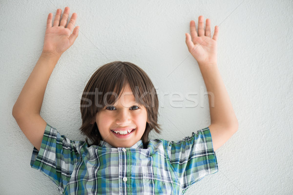 Boy on a white wall Stock photo © zurijeta