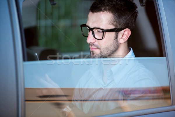 Sleek man with glasses in car Stock photo © zurijeta