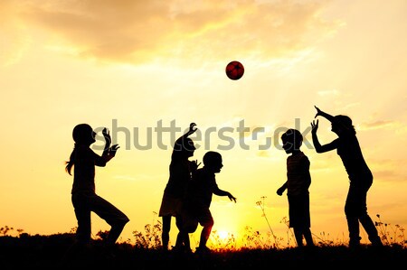 Vintage image of kids running on sunset field Stock photo © zurijeta