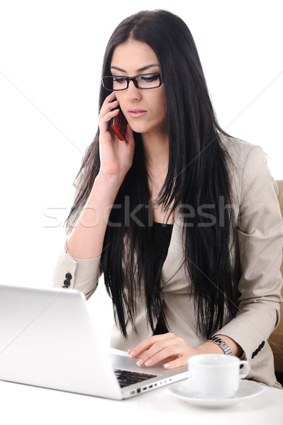 View of business woman holding cell phone and speaking on Stock photo © zurijeta