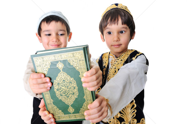 Two beautiful kids holding holy Quran Stock photo © zurijeta