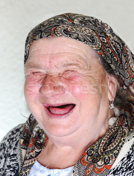 Elderly person, portrait in natural pose laughing Stock photo © zurijeta