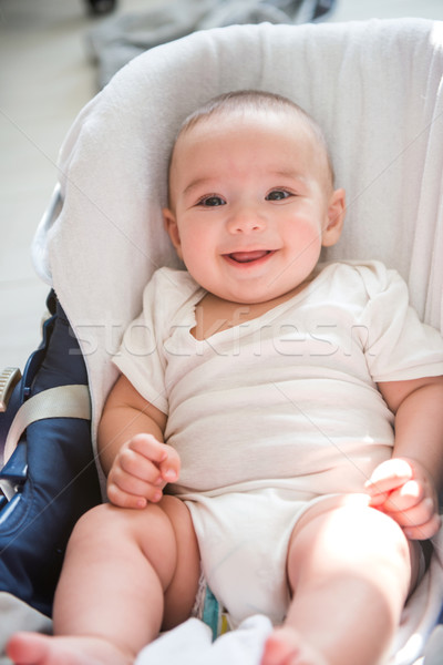 Foto stock: Sorridente · bebê · doce · sessão · carrinho · retrato