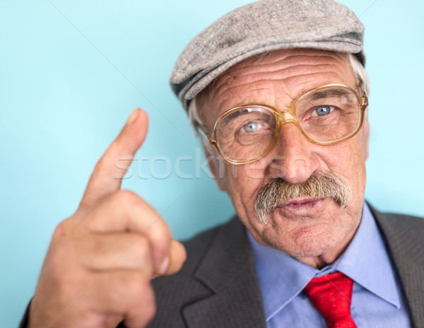 Portrait of a smiling and confident mature businessman with must Stock photo © zurijeta