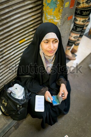 Muslim arabic woman reading book on sofa Stock photo © zurijeta