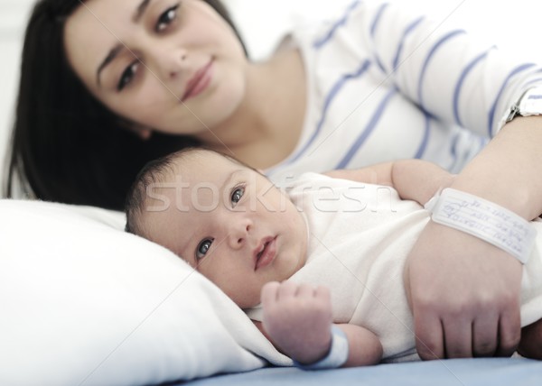 Middle eastern woman with her baby at hospital ro Stock photo © zurijeta