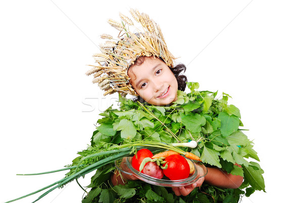 Nice little girl in leafs cloths with wheat hat on head Stock photo © zurijeta