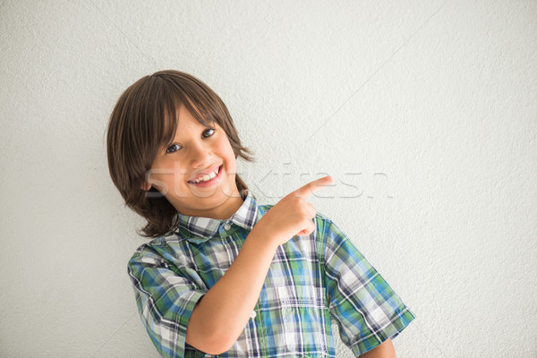 Happy kid pointing Stock photo © zurijeta