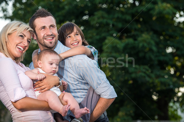 Parents posing with two kids Stock photo © zurijeta