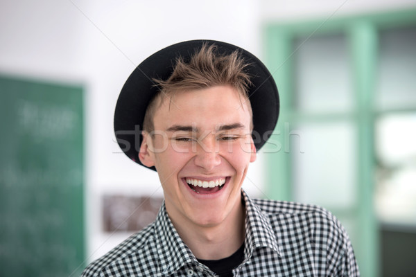 Laughing highschool boy portrait Stock photo © zurijeta