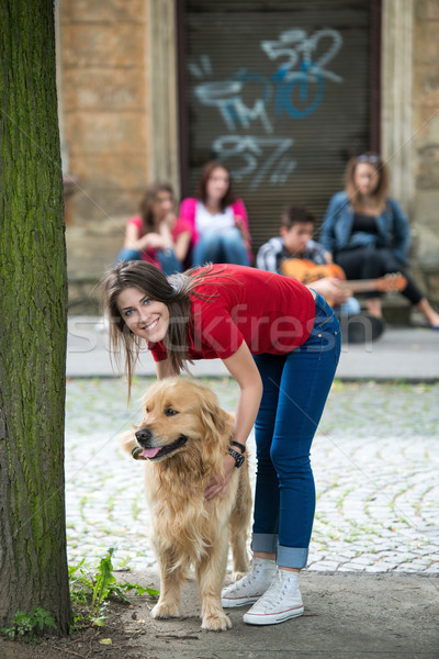 Handsome girl petting a dog Stock photo © zurijeta
