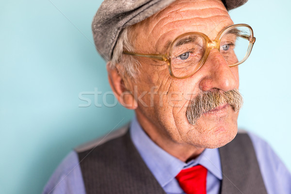 Portrait of a smiling and confident mature businessman with must Stock photo © zurijeta