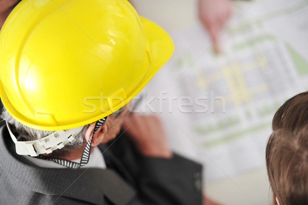 Business partners discussing documents and ideas at meeting Stock photo © zurijeta