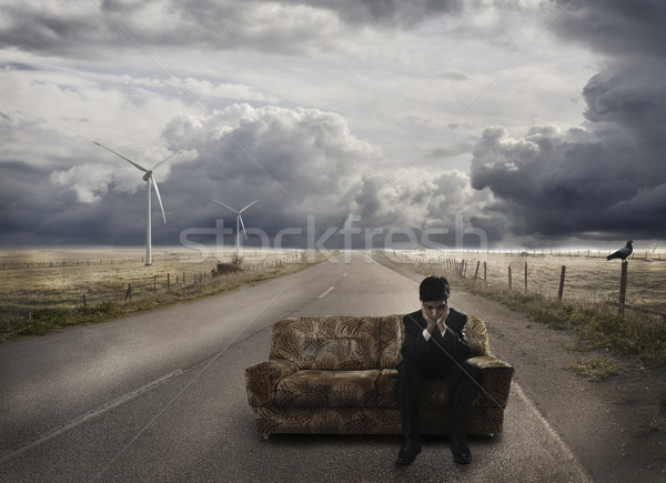 Young businessman waiting on sofa, at the road, disappointed Stock photo © zurijeta