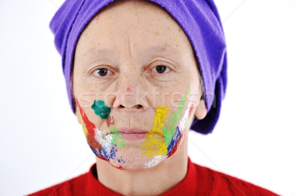 Elderly woman grandmother with painted face over white backgroun Stock photo © zurijeta