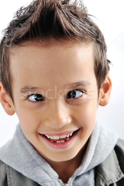 Portrait Of A Smiling Little Mixed Race Boy Isolated On White Ba