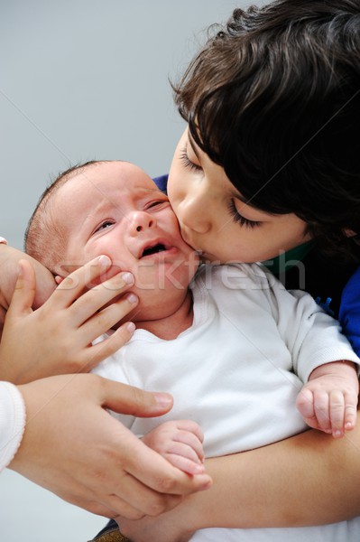 Little boy playing with his new baby brother Stock photo © zurijeta
