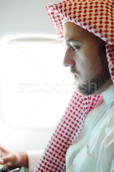 Modern Arabic businessman inside airplane Stock photo © zurijeta