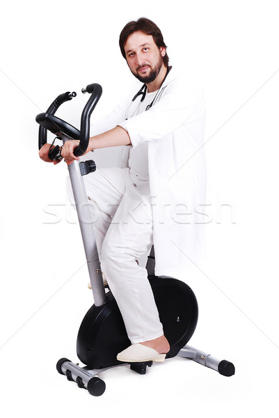 Jovem médico do sexo masculino equitação esportes bicicleta médico Foto stock © zurijeta