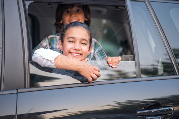 Cute kids looking through car window Stock photo © zurijeta