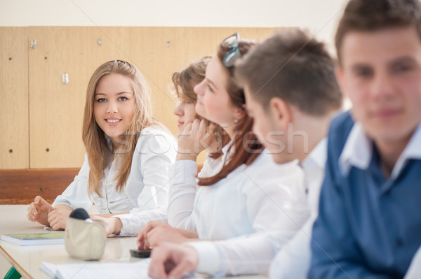 Beautiful girl sitting in a classroom Stock photo © zurijeta