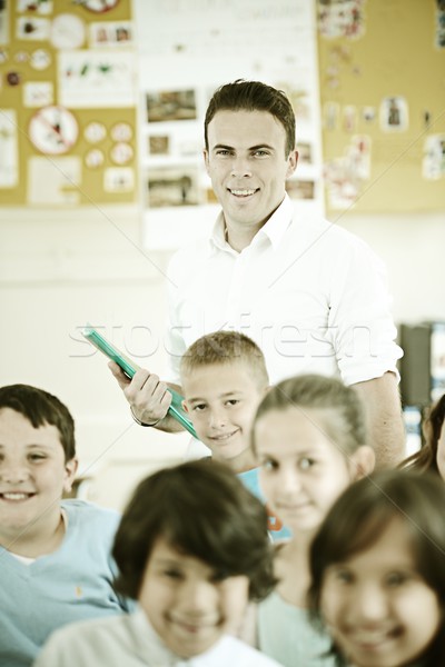 Active real children at classroom having school lesson Stock photo © zurijeta