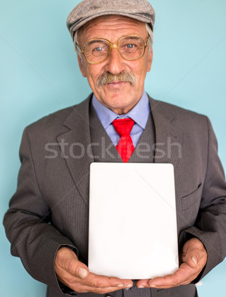 Portrait of a smiling and confident mature businessman with must Stock photo © zurijeta