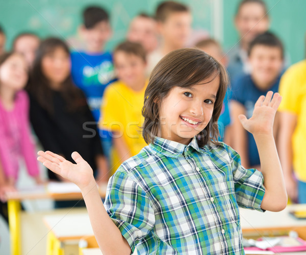 Happy children group with arms outstretched in school classroom Stock photo © zurijeta