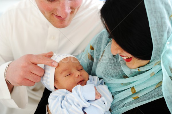 Arabic Muslim couple with new baby at home Stock photo © zurijeta