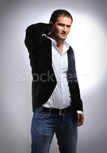 Moço pose jovem macho homem mão Foto stock © zurijeta