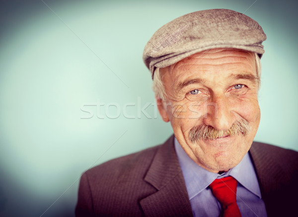 Portrait of a smiling and confident mature businessman with must Stock photo © zurijeta