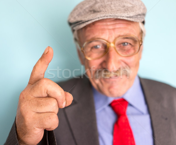 Portrait of a smiling and confident mature businessman with must Stock photo © zurijeta