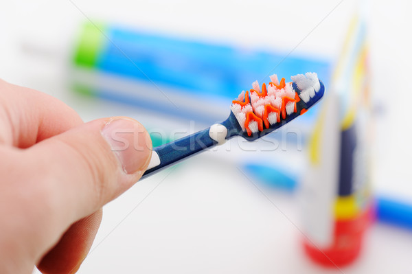 Striped toothpaste on tooth-brush  Stock photo © zurijeta