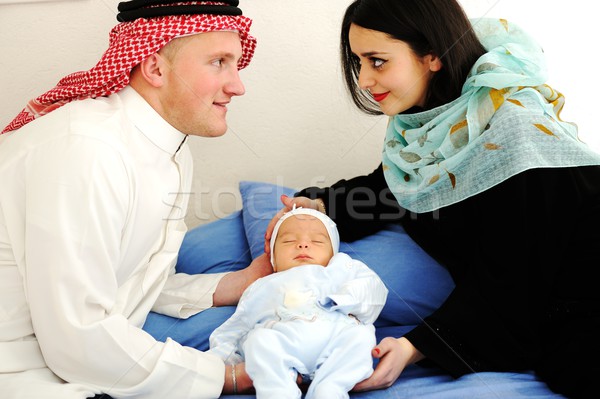 Arabic Muslim couple with new baby at home Stock photo © zurijeta