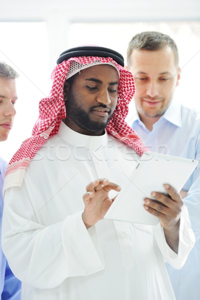 Stock photo: Business international group planning on tablet