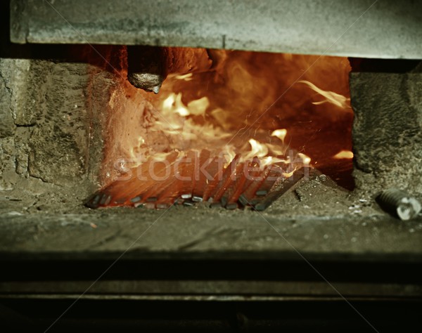 Iron casting process with high temperature fire in old metal par Stock photo © zurijeta