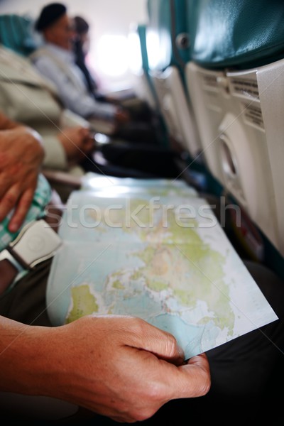 Traveling and looking at the map inside the airplane Stock photo © zurijeta