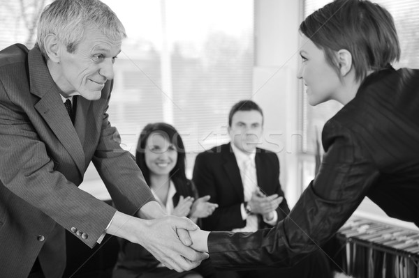 Young business woman passed on a job interview shaking hands wit Stock photo © zurijeta