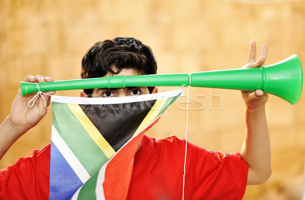 encourager with vuvuzela and flag Stock photo © zurijeta