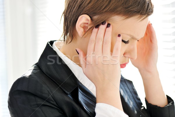 Young depresses stressed business woman at office Stock photo © zurijeta