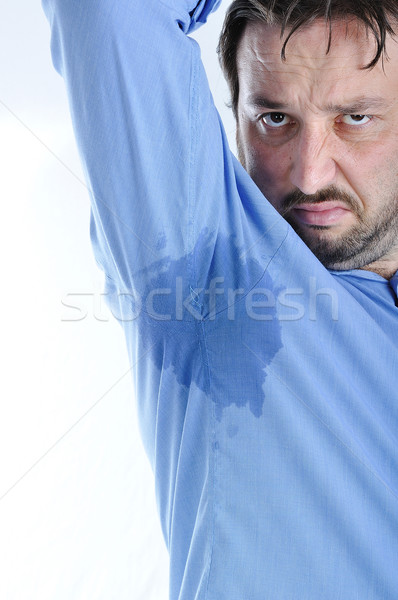 Fiatalember izzadság nyom póló üzlet munka Stock fotó © zurijeta
