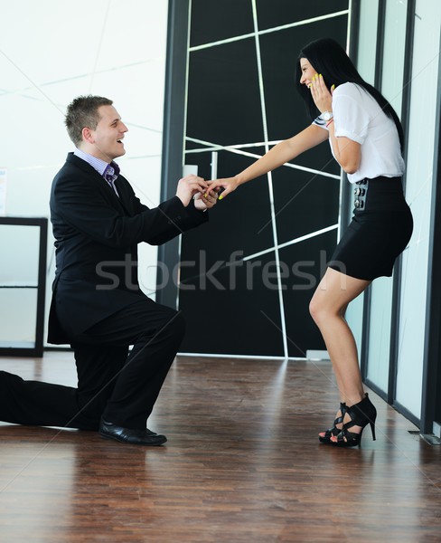 Young man romantically proposing to girlfriend and offering enga Stock photo © zurijeta