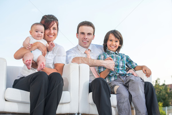 Happy family sitting outside Stock photo © zurijeta