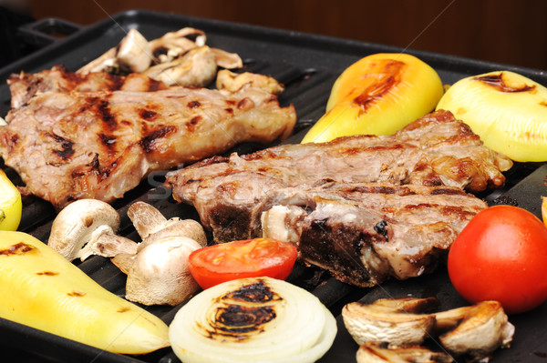 Barbecue, prepared beef meat and different vegetables and mushrooms on grill Stock photo © zurijeta