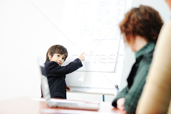 Genius kid on business presentation speaking to adults and giving them a lecture Stock photo © zurijeta