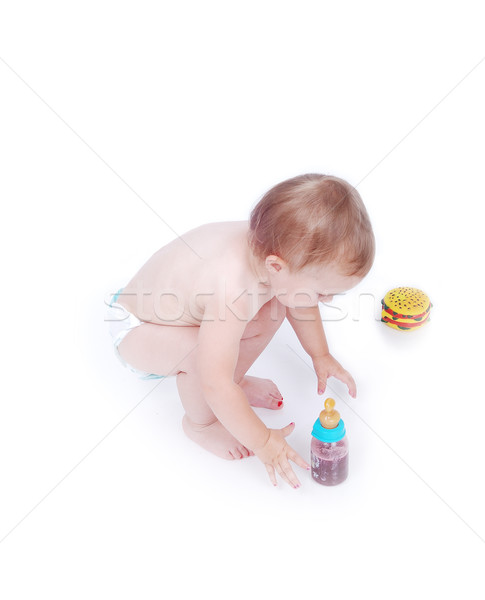 Baby between hamburger and drinking bottle Stock photo © zurijeta
