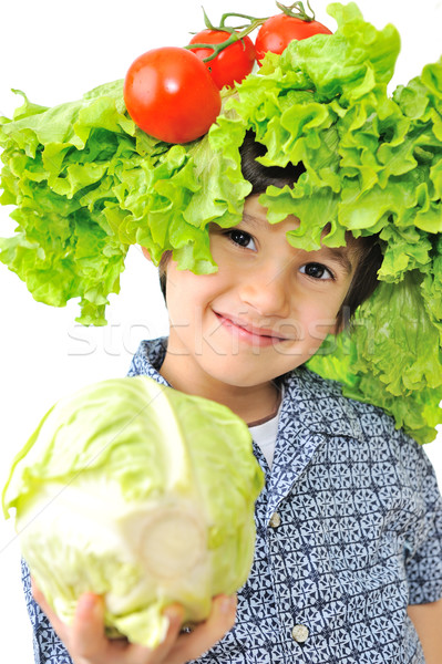 Stock photo: Beautiful little kid with tomato and salad hat on his head holding cabbage