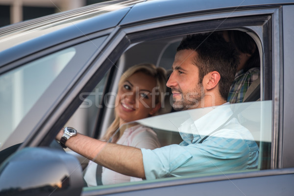 Happy couple driving in automobile Stock photo © zurijeta