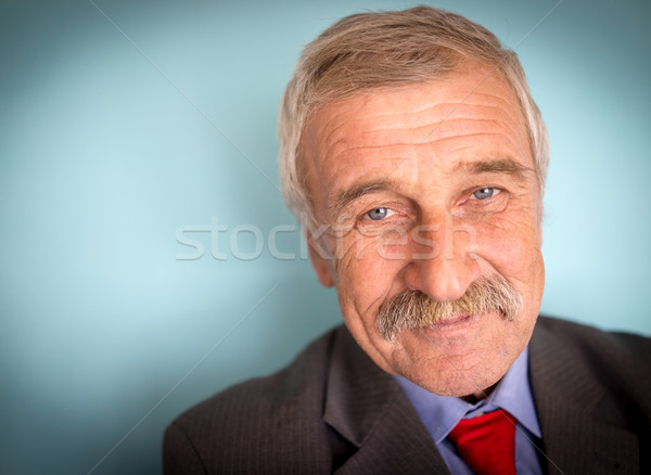 Portrait of a smiling and confident mature businessman with must Stock photo © zurijeta