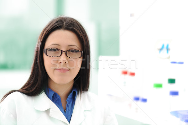 Stock photo: Inside the modern lab of university hospital, young confidental successful doctors and scientists